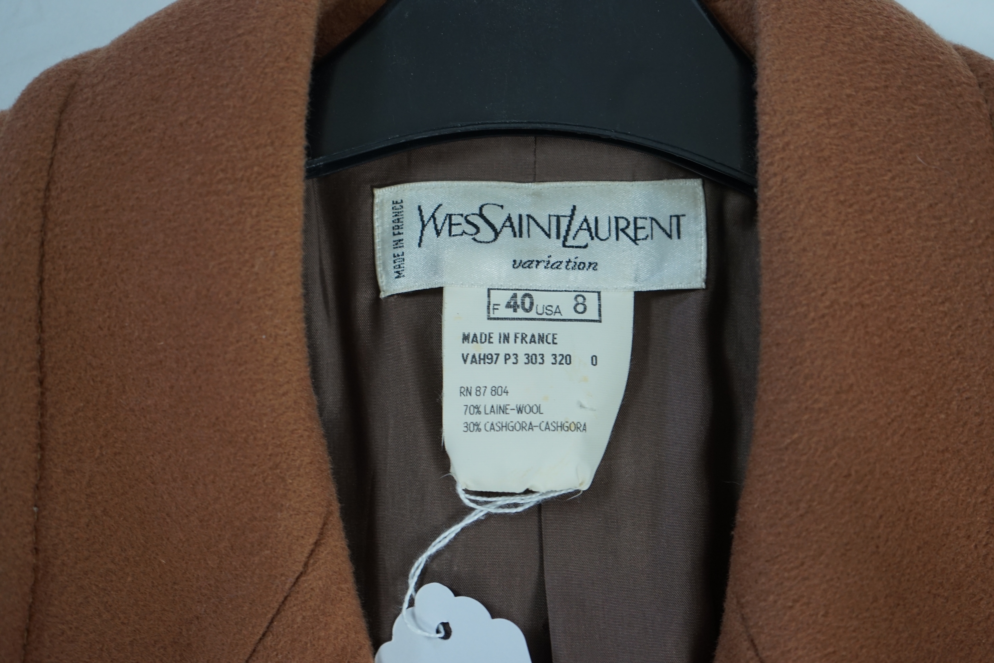 A vintage Yves Saint Laurent variation lady's dark tan double breasted coat, F 40 (UK 12). Proceeds to Happy Paws Puppy Rescue
